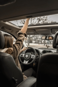 A woman taking a road trip.