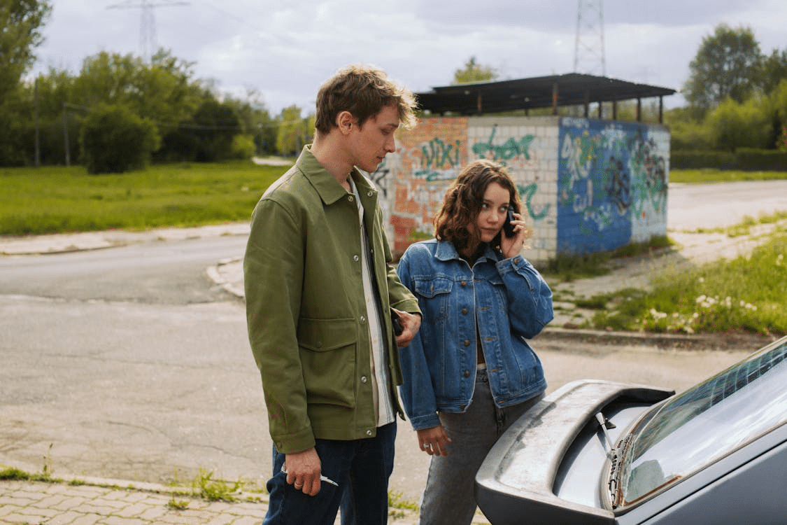 A couple gets locked out of a car.